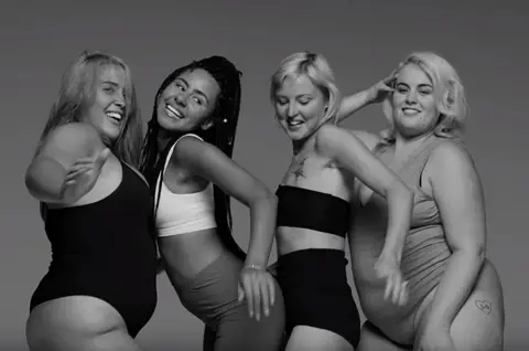 Little Mix Kris Hallenga (second from right) in the Little Mix video for the song Strip