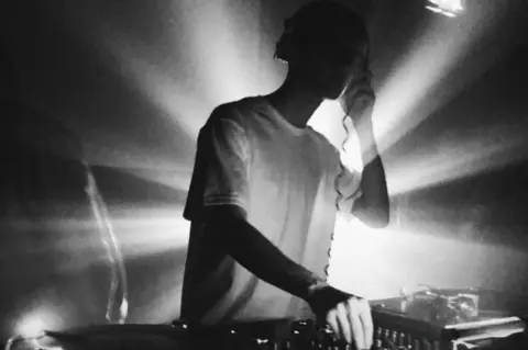 Family handout/PA Media Alex at a DJ gig