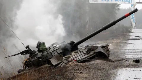 Getty Images Russian tank destroyed by the Ukrainian forces on the side of a road in Luhansk region 26 February 2022