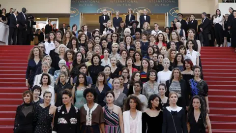 EPA Actresses and female directors stand on the steps of the red carpet in protest of the lack of female filmmakers honoured throughout the history of the festival during the 71st annual Cannes Film Festival, in Cannes, France, 12 May 2018.