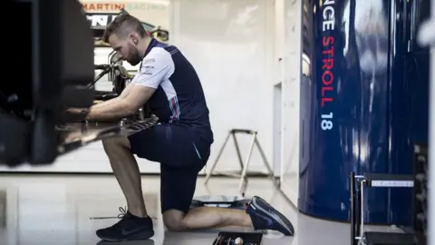Williams F1 Jack Hoodless working on Lance Stroll's car in Australia