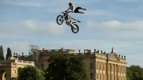 OLI SCARFF/AFP Stunt bikers