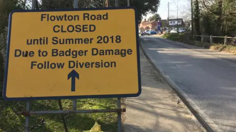 BBC A sign warning drivers of the closure