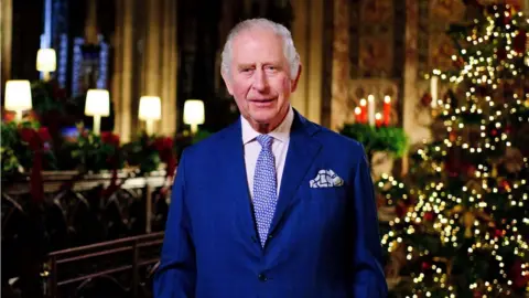 Getty Images King Charles III is seen during the recording of his first Christmas broadcast in the Quire of St George's Chapel at Windsor Castle, on December 13, 2022 in Windsor, England