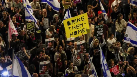 Reuters People attend a protest in Tel Aviv, Israel. to pressure the Israeli government do more to secure the release of hostages held by Hamas in Gaza (27 April 2024)
