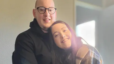 Alannah Alannah hugging her partner Jaimie