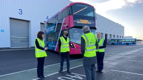 BBC Minister for Infrastructure Nichola Mallon and Translink staff with one of the new hydrogen-powered buses