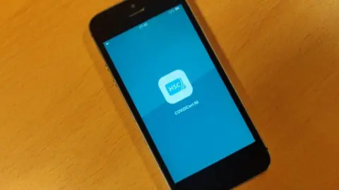 BBC The CovidCertNI app on a mobile phone