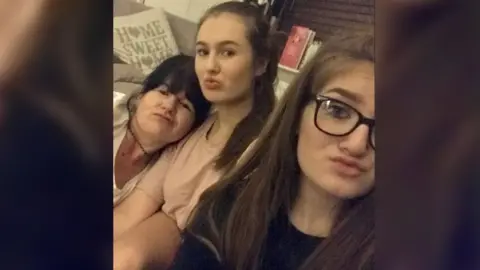 Tanya Russell Three women posing for the camera