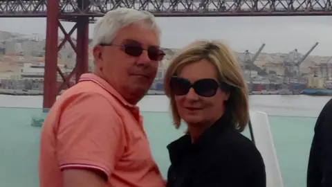 Family photo A colour photo of Justin and Selina with a river in the background