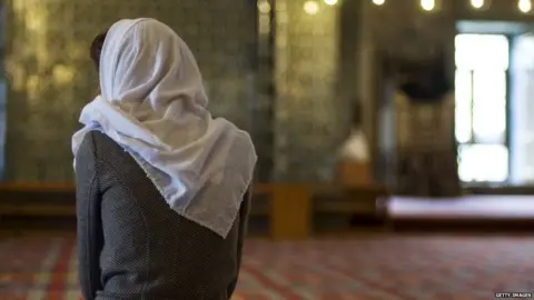 Getty Images Female Muslim in a mosque