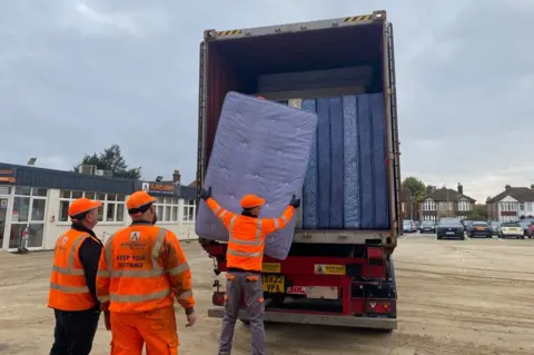 Unloading mattresses at Ardent Hire Solutions