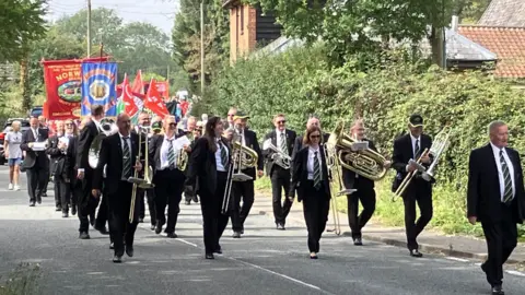 Andrew Sinclair/BBC The annual Burston strike school rally