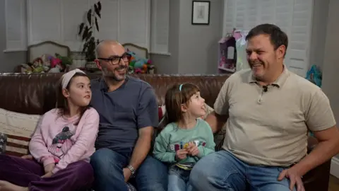 BBC Rio and Daniel with their daughters