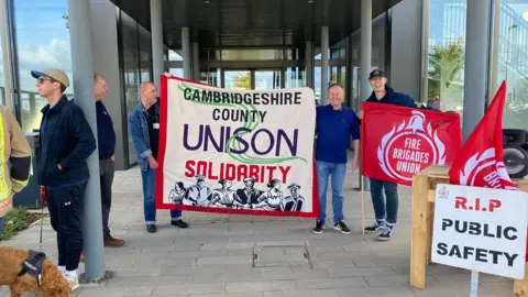 Jozef Hall FBU members protesting at a Cambridgeshire Fire Authority meeting