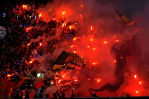 Getty Images Esperance fans ignite the flames during Tunisia championship - match between Esperance Sportive Tunis (EST) vs Union Sportive Tataouine (UST) at the Rades stadium in Tunis, Tunisia, on November 05,2022