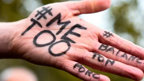 AFP A MeToo message on a hand