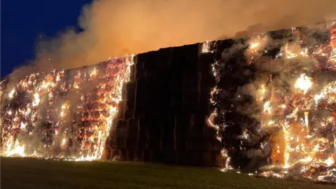 Essex Fire and Rescue Service Straw stack on fire in Harlow, Essex