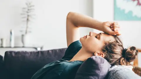 Getty Images Woman on sofa