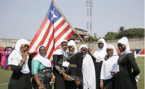 AFP Liberian Muslim women poses with the Liberian flag during observance of World Hijab Day in Monrovia, Liberia, 01 February 2019.