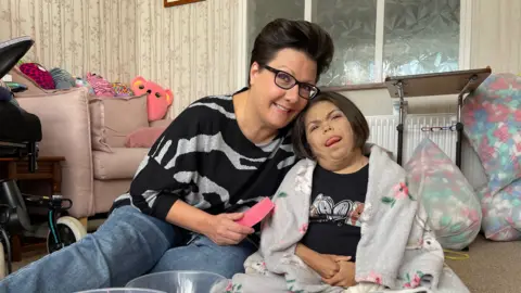 Jamie Niblock/BBC Seven-year-old Erin and her mother Helen Sadler