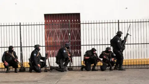 Reuters Members of Nicaragua's Special Forces are seen next to a church during clashes with anti-government protesters in the indigenous community of Monimbo in Masaya, Nicaragua July 13, 2018