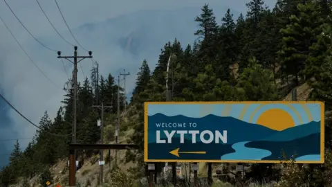 Reuters The sign for the town of Lytton, where a wildfire raged through and forced residents to evacuate, is seen in Lytton, British Columbia, Canada July 1, 2021.