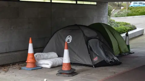 Alamy Homeless people sleeping in tents in an underpass in Milton Keynes in March 2020