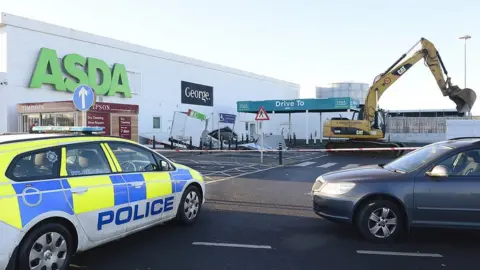 PAcemaker A large digger in the carpark of Asda in Antrim