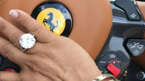 Instagram/princedubai_07 Anthony Gignac shares a photo of his hand, adorned in a large ring, resting against the wheel of his ferrari