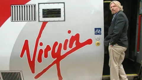 PA Richard Branson boarding a Virgin train