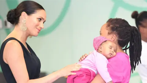 PA Media The Duchess of Sussex visiting mothers2mothers in Cape Town