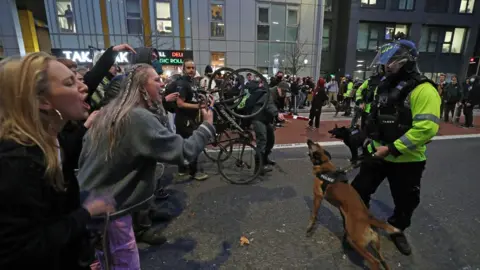 PA Media Protesters and police face off