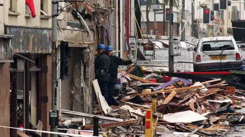 PAcemaker Structural engineers begin to examine the scene in and around the Explosion