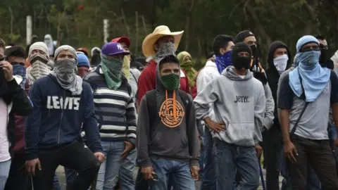 AFP Student teachers from Ayotzinapa angry for the disappearance of 43 students are pictured during clashes with the riot police along the Tixtla-Chilpancingo highway in Tixtla, Guerrero State, Mexico, on September 22, 2015.