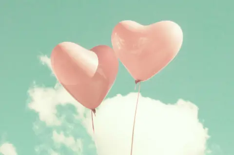 Joanna Mecner Two heart shaped balloons