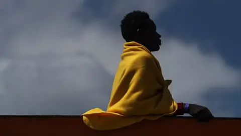 Getty Images A migrant in the Italian port of Salerno.