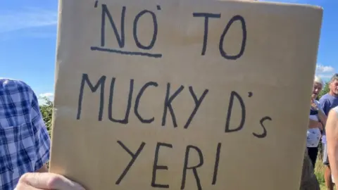 Sign that reads 'No to Mucky D's yer'