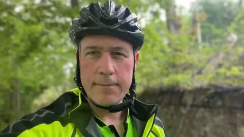 Anya Josceleyne Jonny in a bike helmet