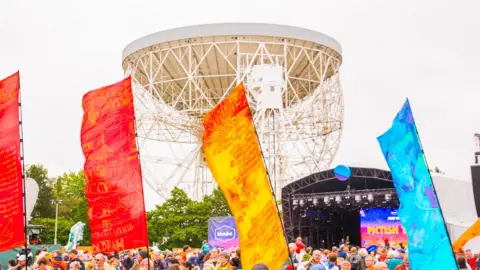 Bluedot Parade at bluedot with colourful banners