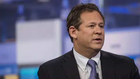 Bloomberg via Getty Rick Rieder, chief investment officer of global fixed income at BlackRock Inc., speaks in a suit and tie during a Bloomberg Television interview in New York, U.S., on Thursday, May 19, 2016