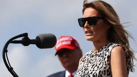 Reuters First Lady Melania Trump speaks next to U.S. President Donald Trump during his campaign rally outside Raymond James Stadium, in Tampa, Florida, U.S., October 29, 2020