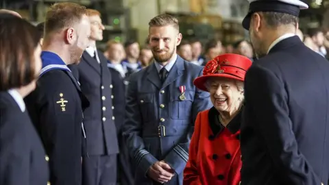 PA Media The Queen talking to people during a visit to HMS Queen Elizabeth in Portsmouth