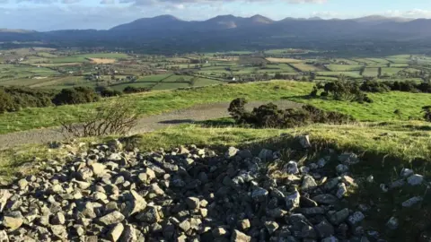 BBC The view of the Mourne mountains from Knock Iveagh Cairn outside Rathfriland