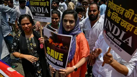 Getty Images Protest in Delhi on 20 July 2023 by members of the Indian Youth Congress against sexual assault of women in Manipur