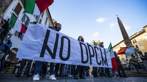 EPA Protest against coronavirus restrictions in Rome, Italy, 13 November 2020.