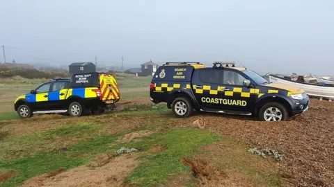 Aldeburgh Coastguard Rescue Team Coastguard and Royal Navy teams attending the suspected bomb on Sizewell beach