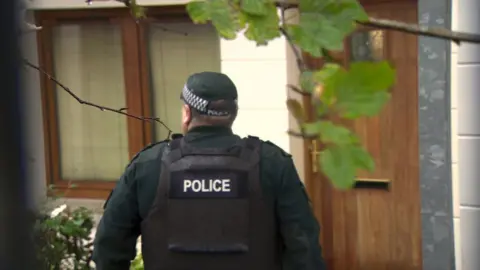 BBC police attend one of the places where the trafficking was taking place