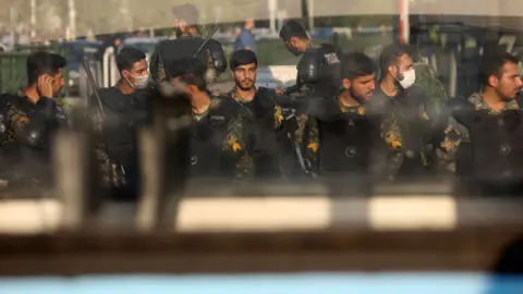 WANA NEWS AGENCY via REUTERS Iranian riot police stand in a street in Tehran, Iran (3 October 2022)