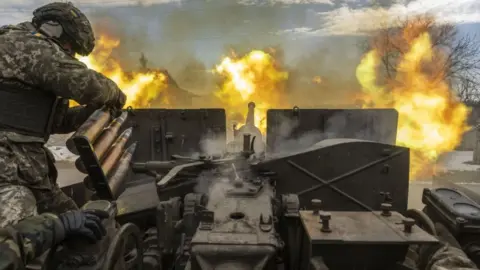 Getty Images Ukrainians firing artillery in eastern Ukraine